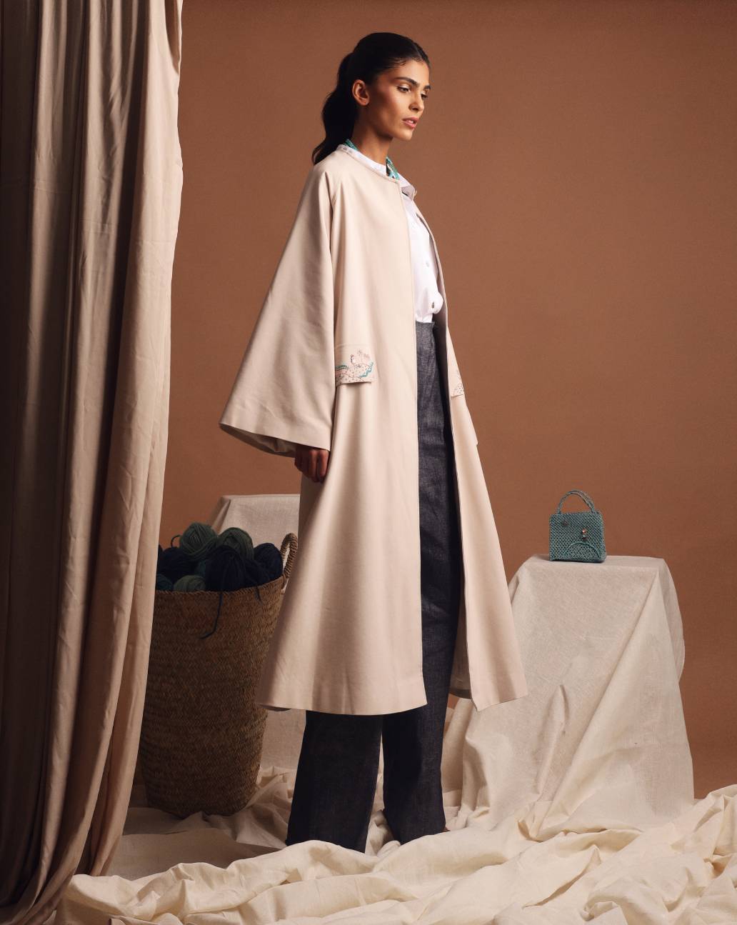 Under the palm trench coat