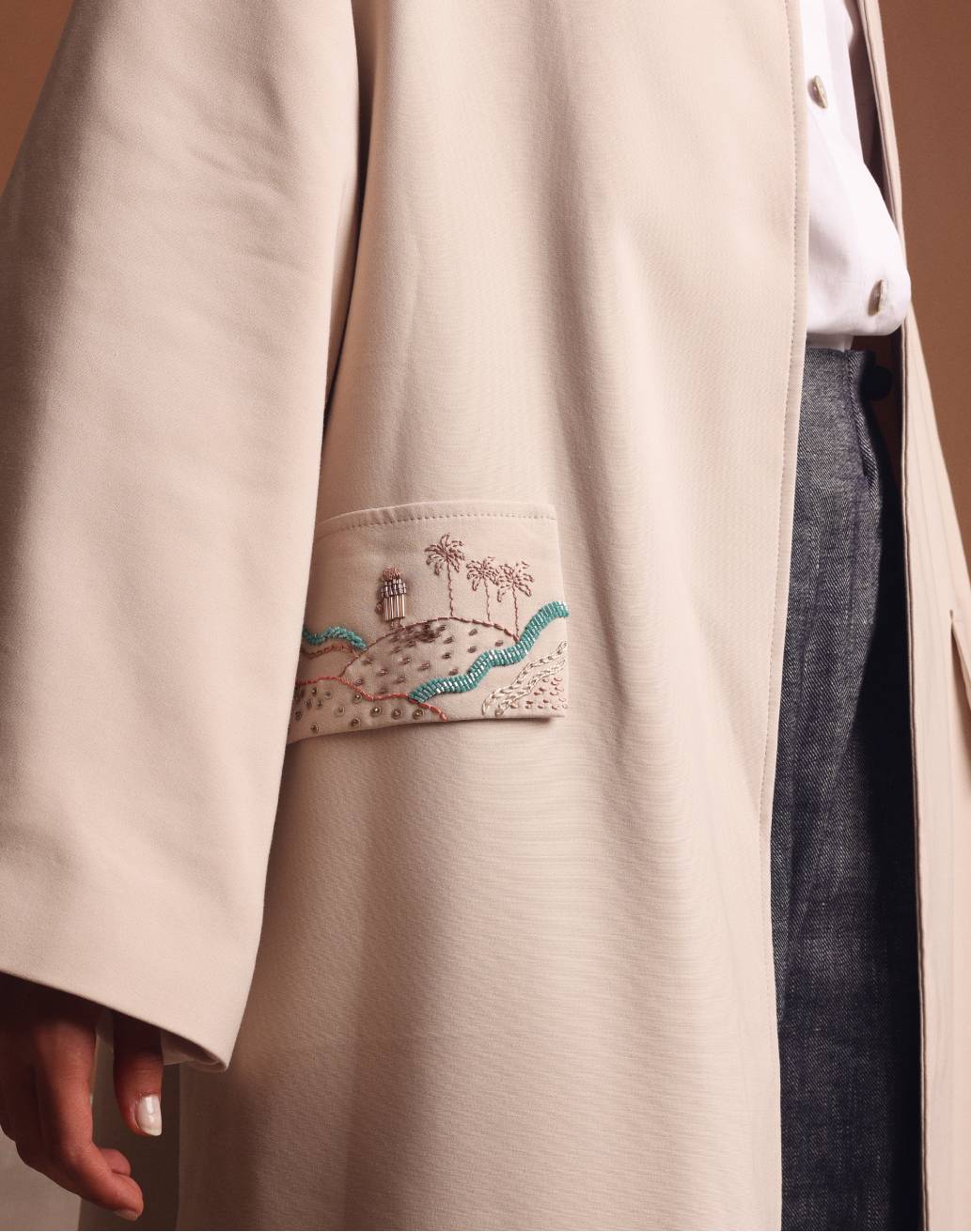 Under the palm trench coat