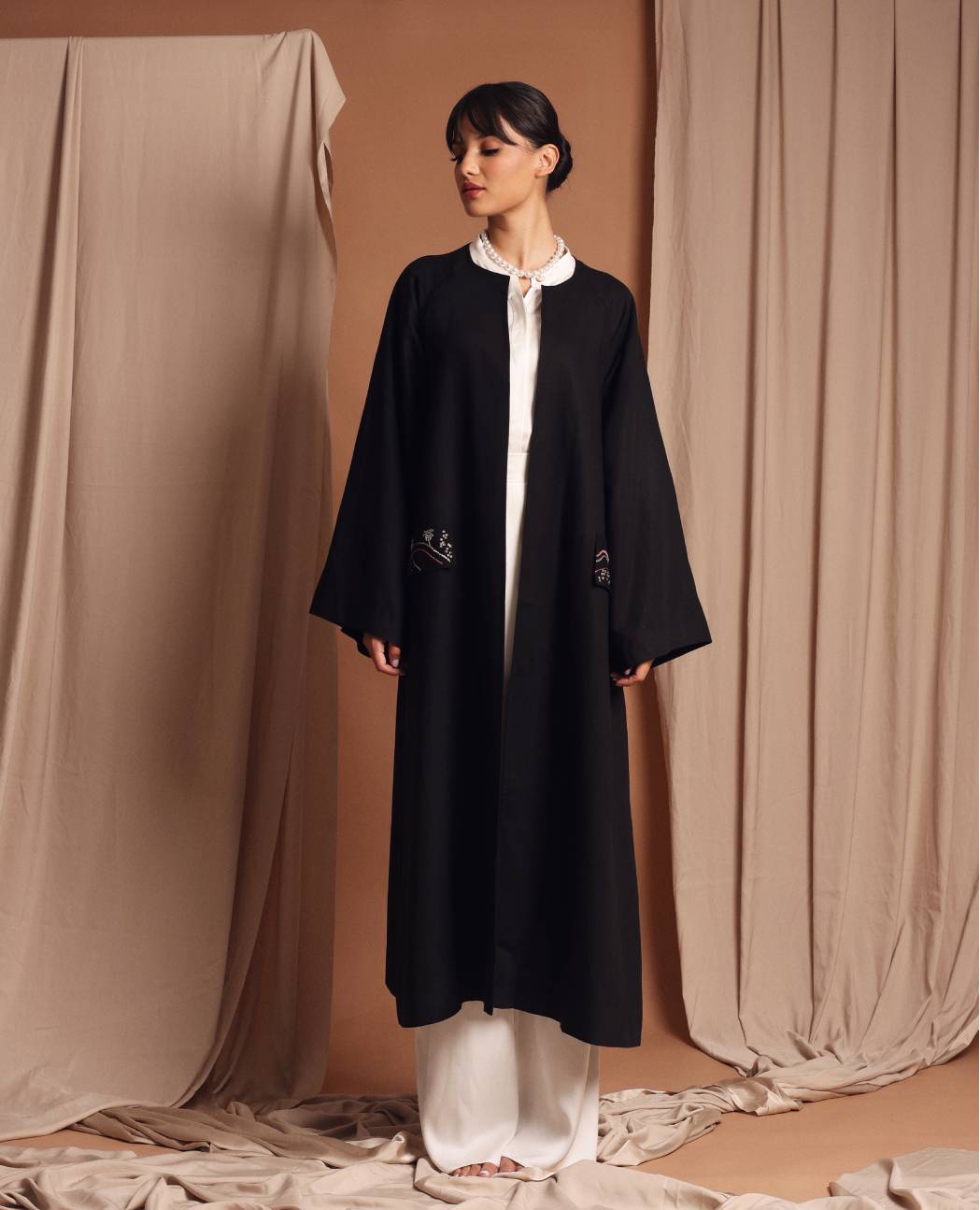 Under the palm trench coat