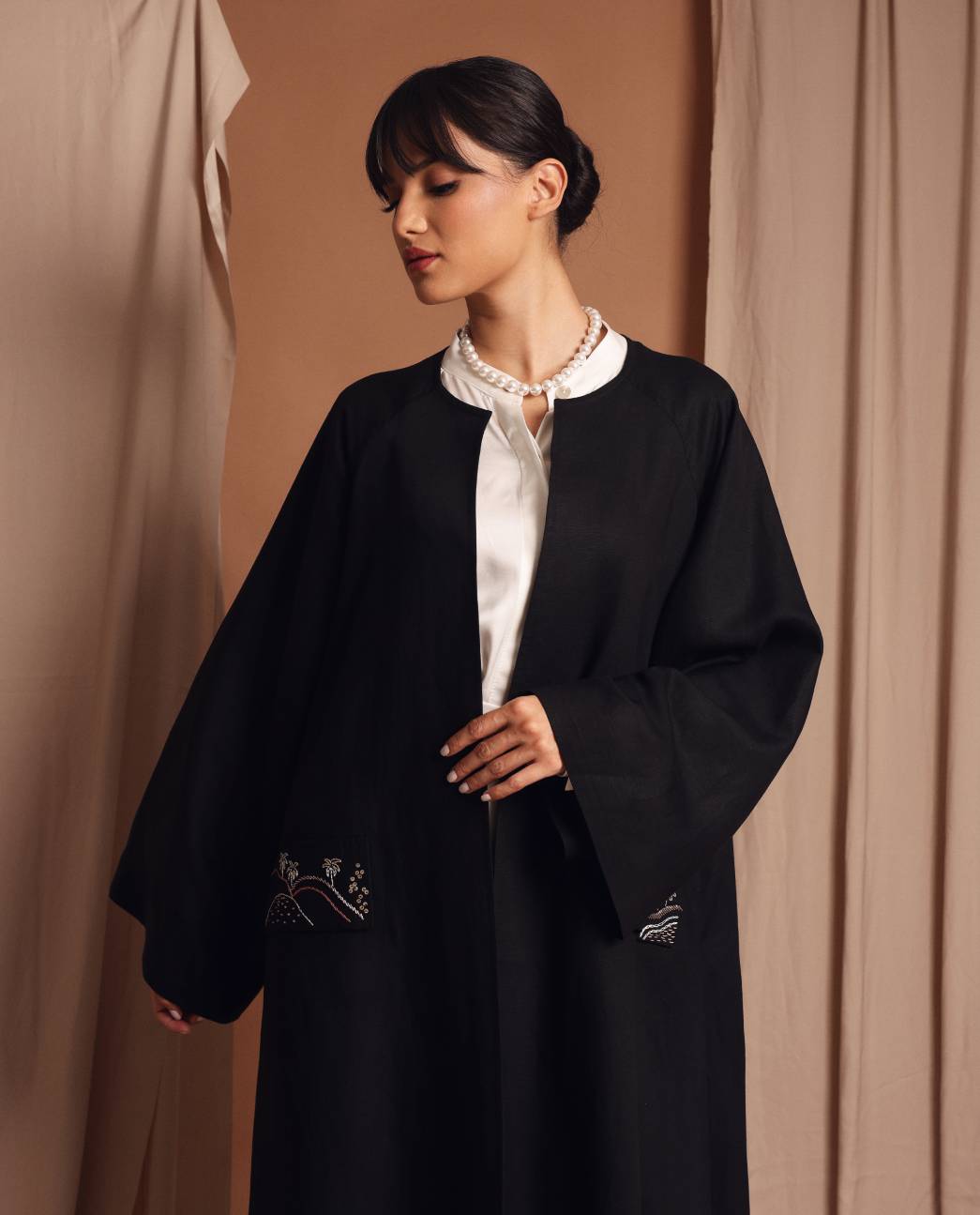 Under the palm trench coat