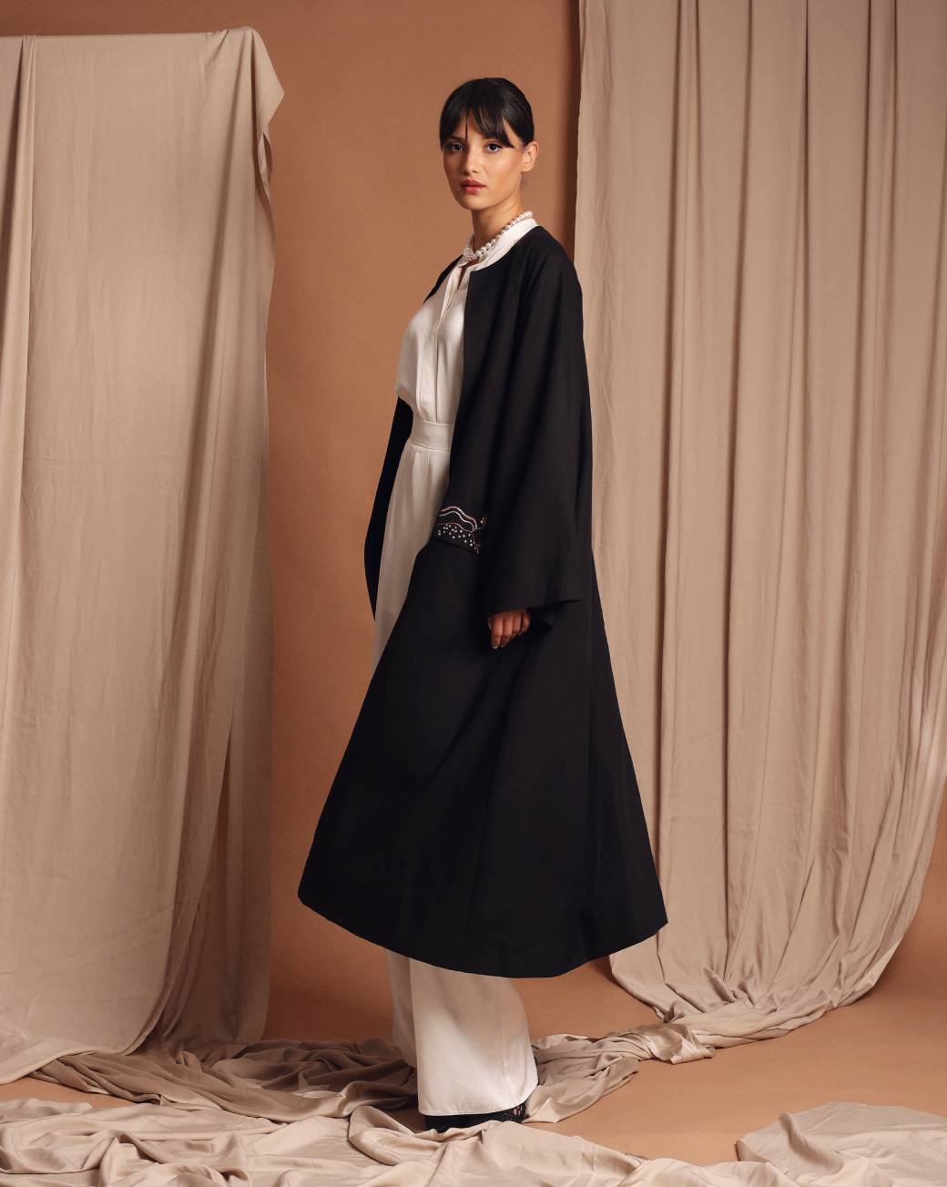 Under the palm trench coat