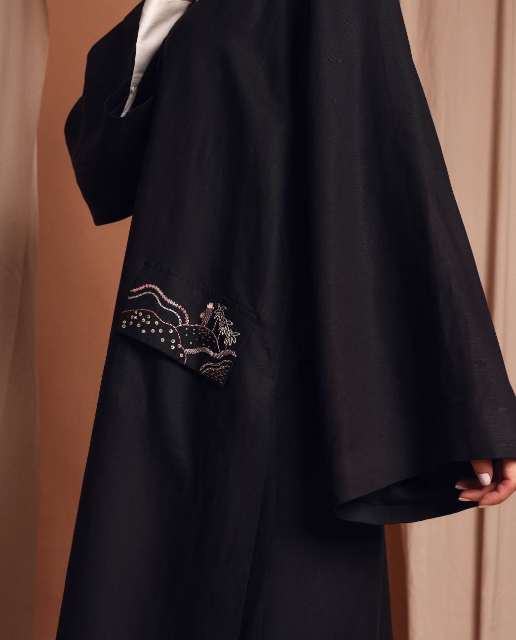 Under the palm trench coat