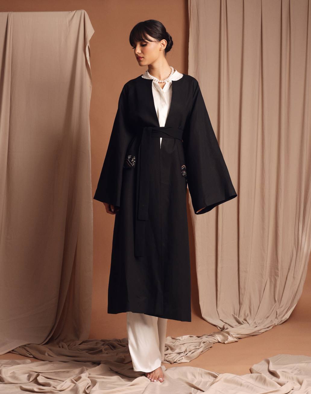 Under the palm trench coat