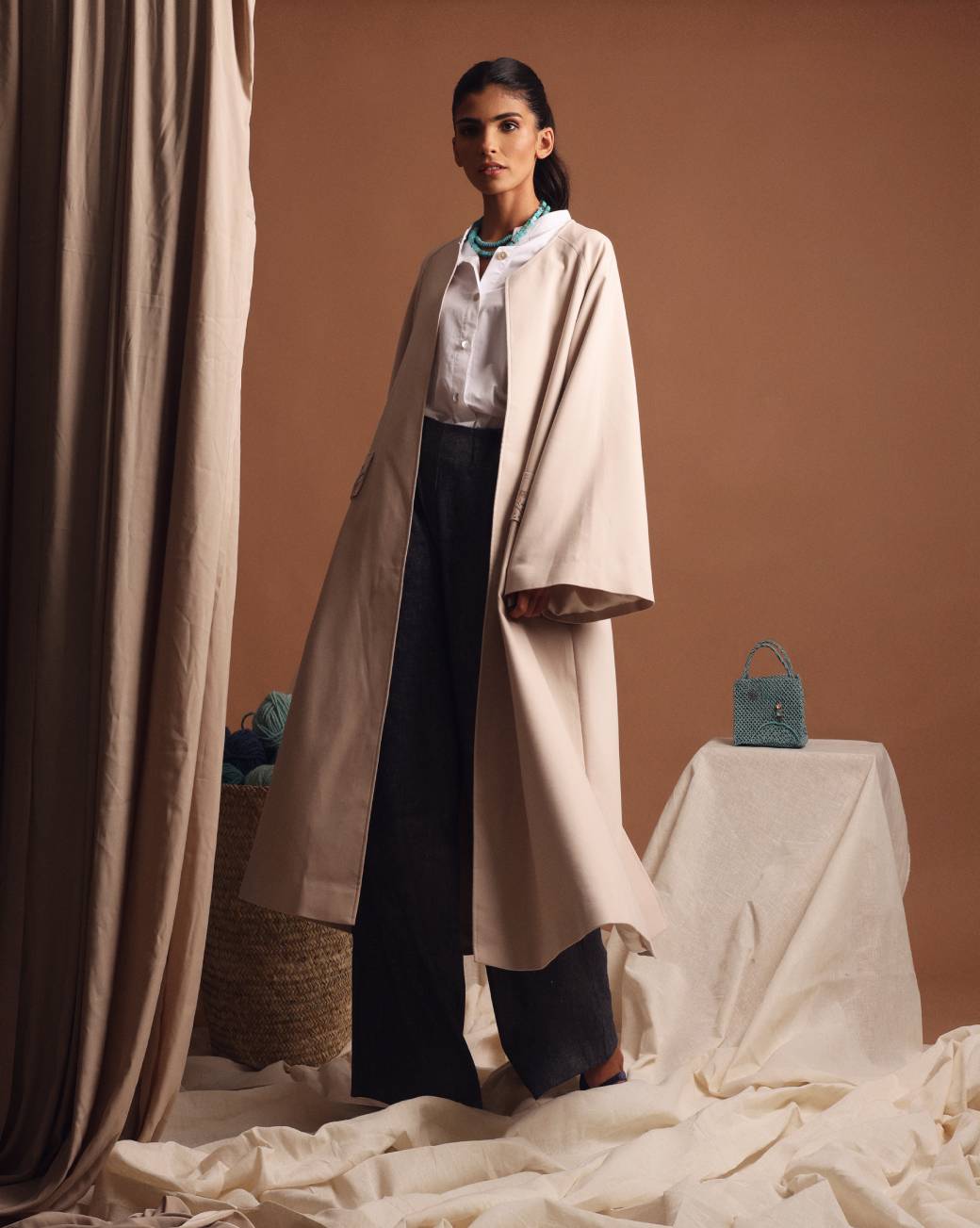 Under the palm trench coat